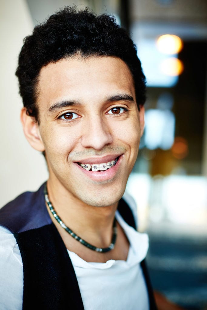 Portrait of a smiling teen boy in braces